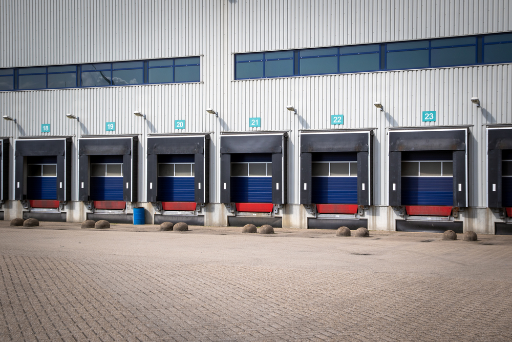 Row of loading docks with shutter doors at an industrial warehouse in Kansas City, MO